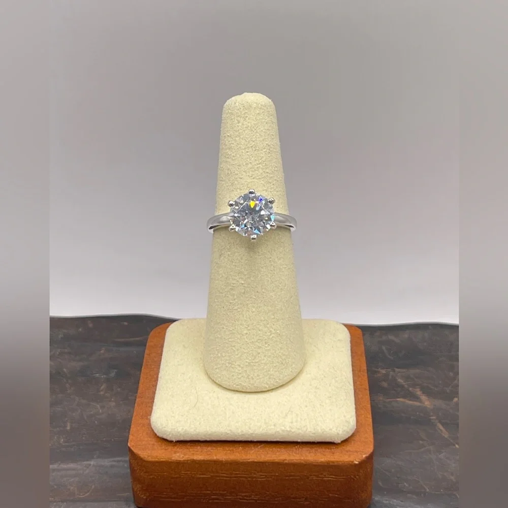 Two (2) carat cz solitaire in a 925 sterling silver setting. Size 6.25.